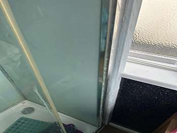 Newly fitted shower screen and enclosure in a refurbished bathroom